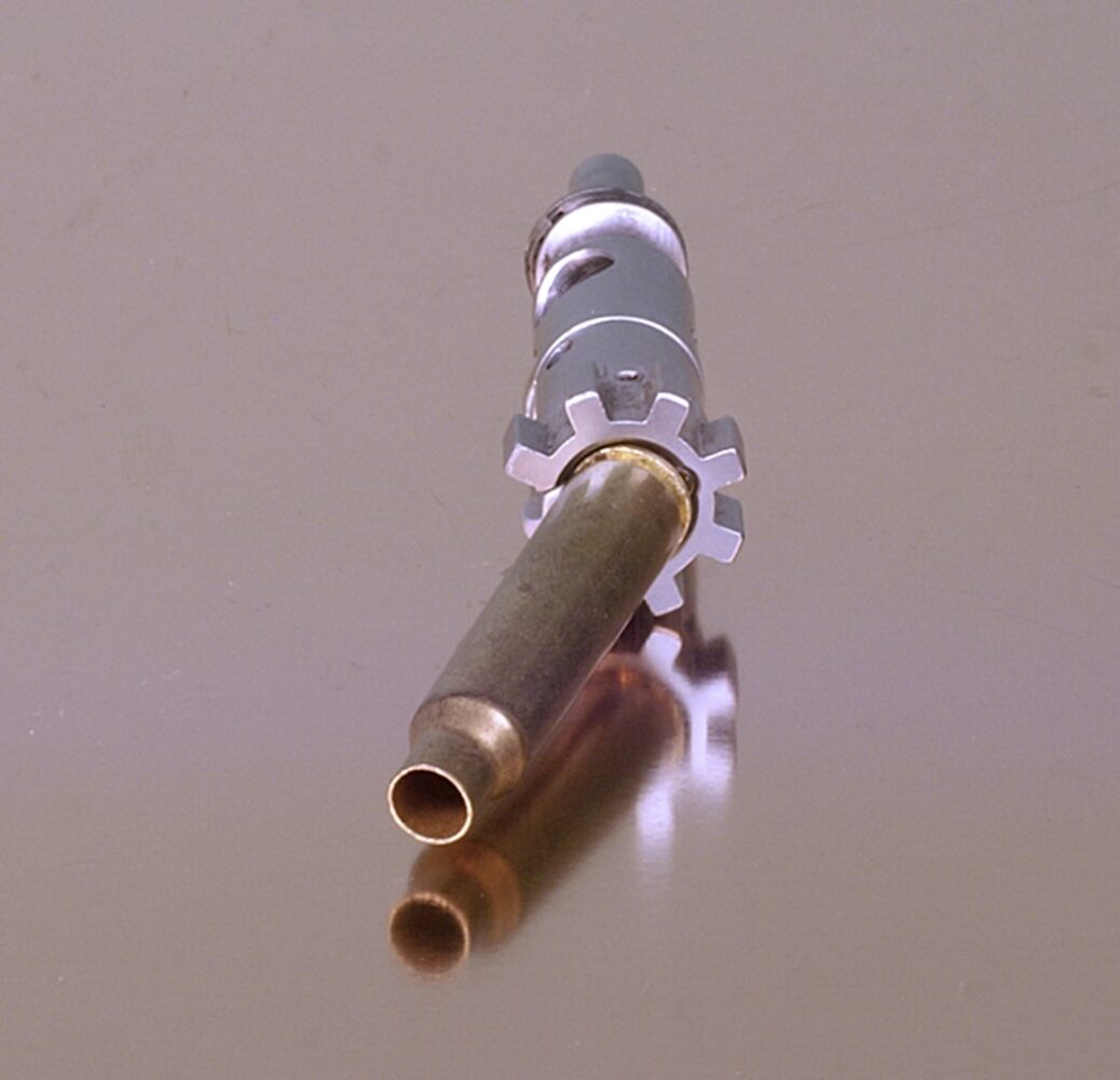bolt and extractor griping shell casing as example
